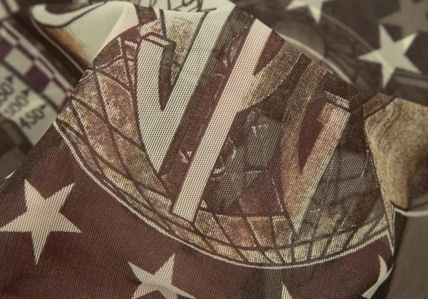 ジャンポールゴルチエJean Paul GAULTIER PARIS グラフィックプリントパワーネットカットソー ベージュモカ40 K-105607_010