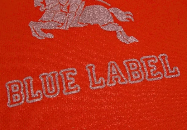 バーバリー ブルーレーベルBURBERRY BLUE LABEL グリッターカレッジロゴプリント7分袖スウェット オレンジM K-111356_011