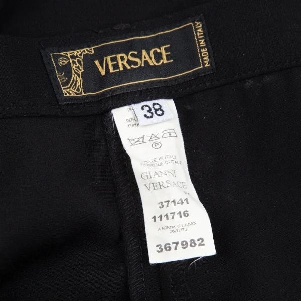 ヴェルサーチVERSACE ストレッチメデューサボタンパンツ 黒38 K-116823_012