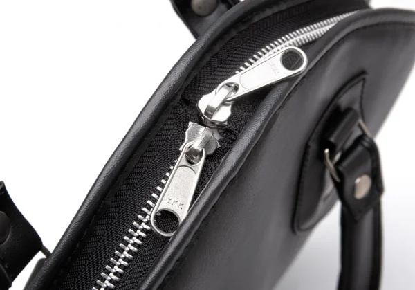 コムコム コムデギャルソンCOMME des GARCONS シンセティックレザーサークルシルエットバッグ 黒 K-119483_009