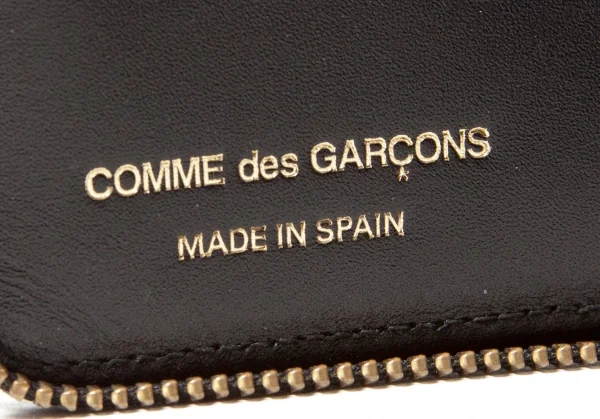 コムデギャルソンCOMME des GARCONS 型押しレザーラウンドジップ